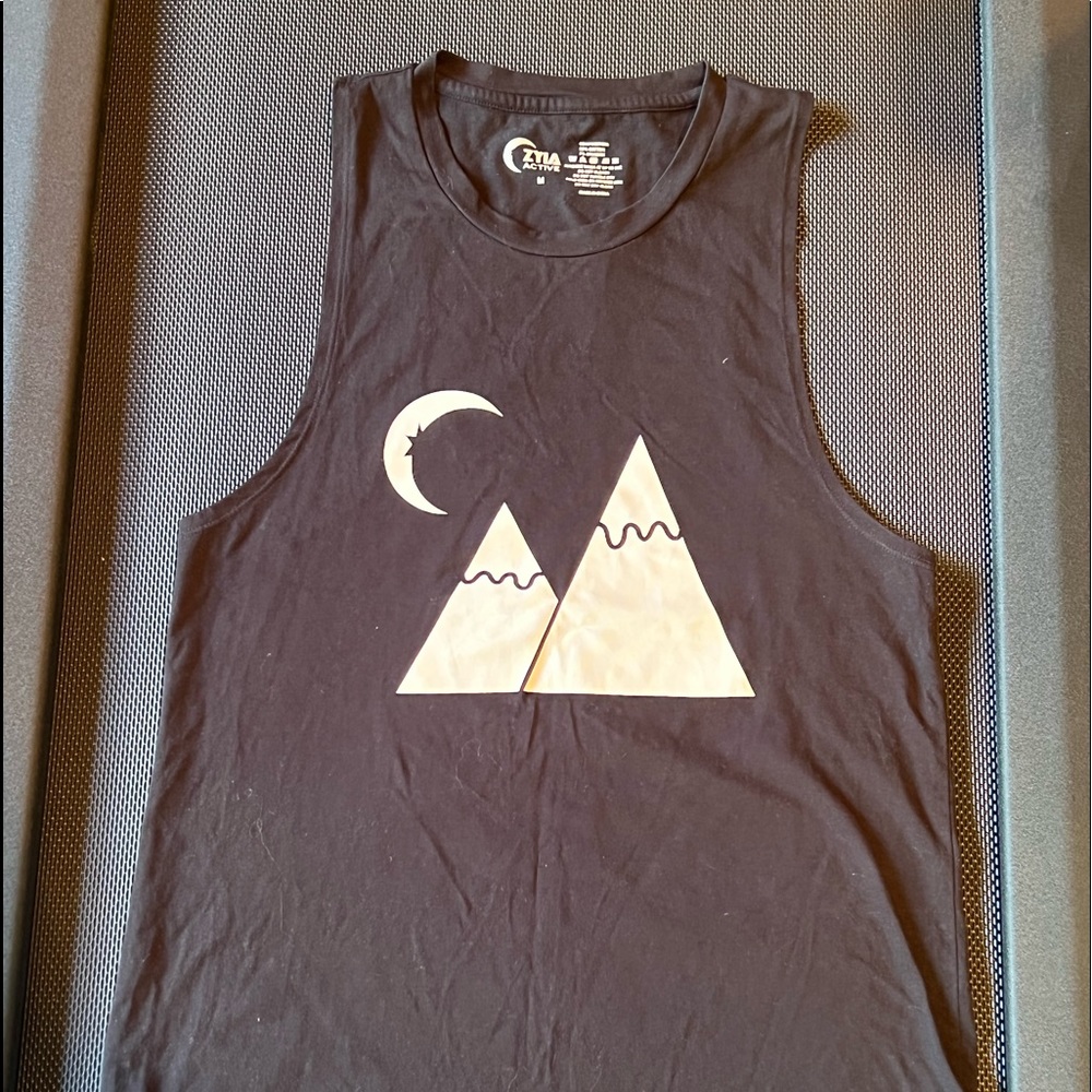 Black and white sleeveless ZiYa top.  Size medium.